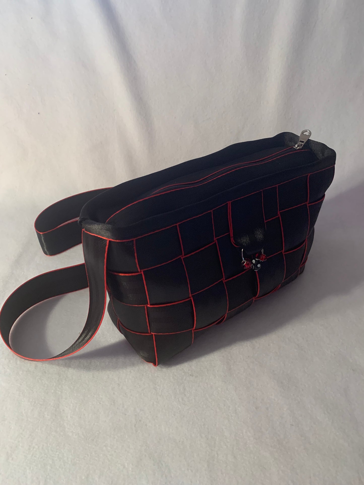 Cross Body Seat Belt Purse in black with red edges, zipper and flap, washable, various linins available
