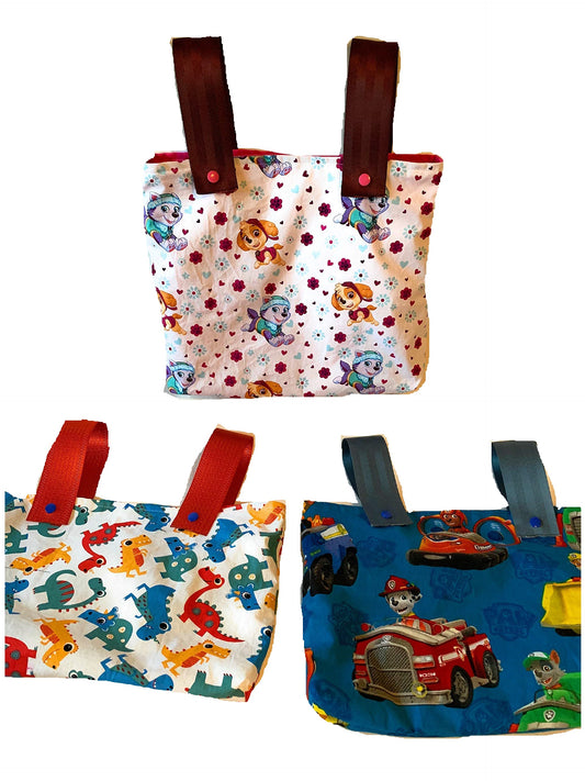 Children's walker bag with seat belt straps and snaps in various patterns