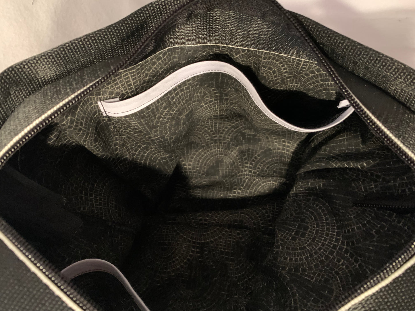 Seat Belt Purse in black with white edges, zipper, washable, geometric lining, large satchel, shoulder straps