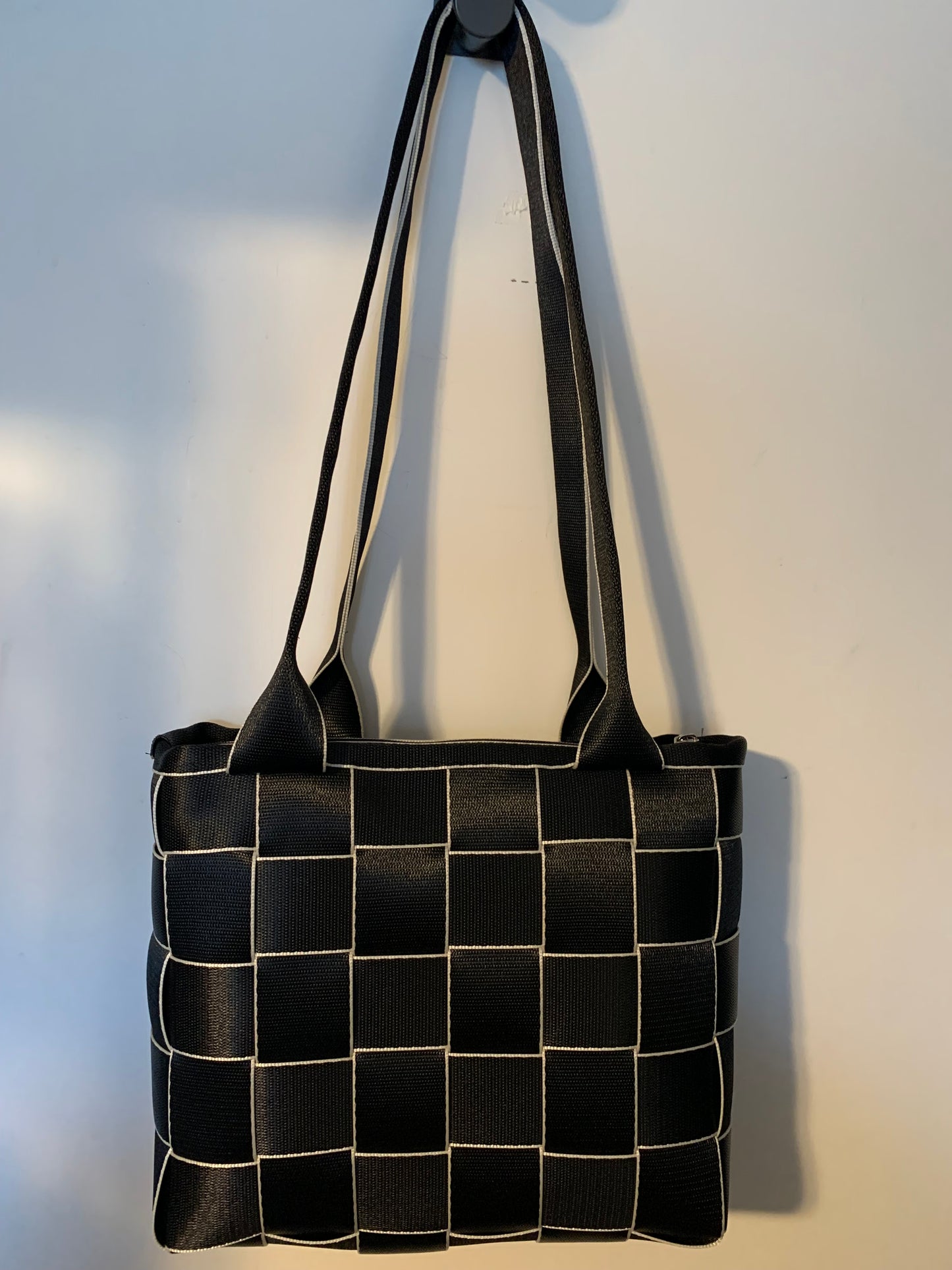 Seat Belt Purse in black with white edges, zipper, washable, geometric lining, large satchel, shoulder straps