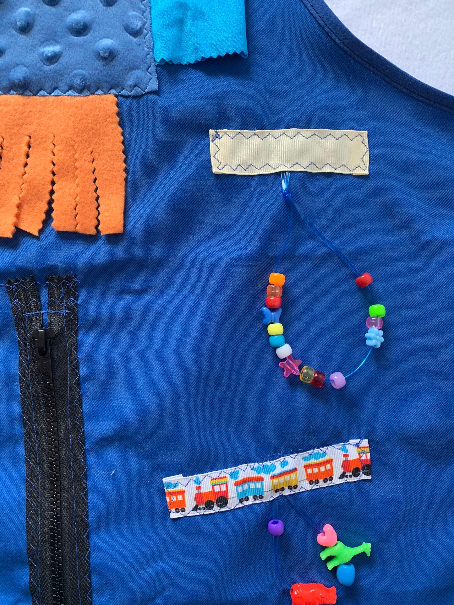 Adult Fidget Apron, tactile apron, various fidgets and ribbons, zipper, washable