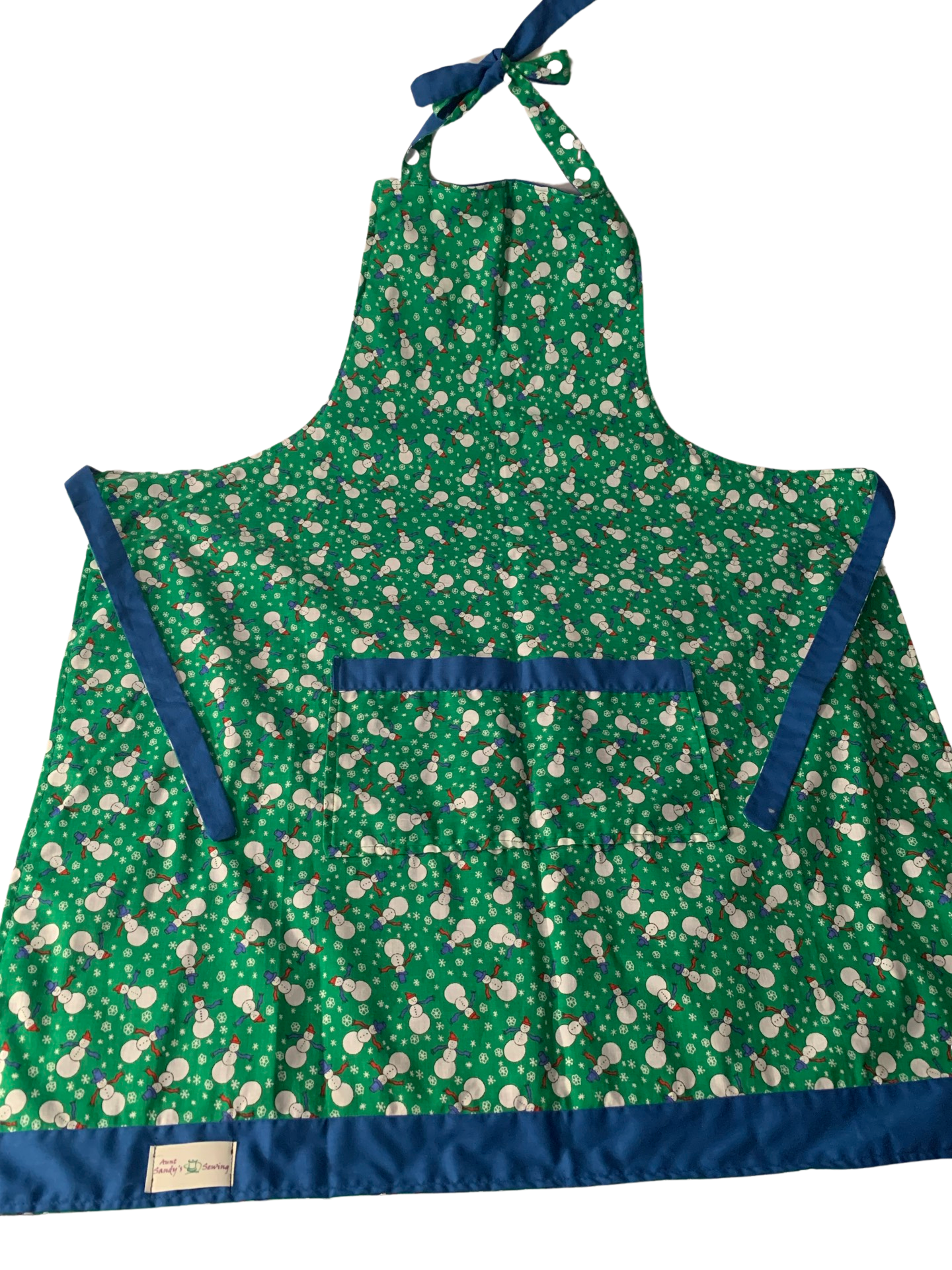 Adult Reversible Christmas Apron. Fun snowman print with blue on reverse side. Large pockets on both sides. Washable