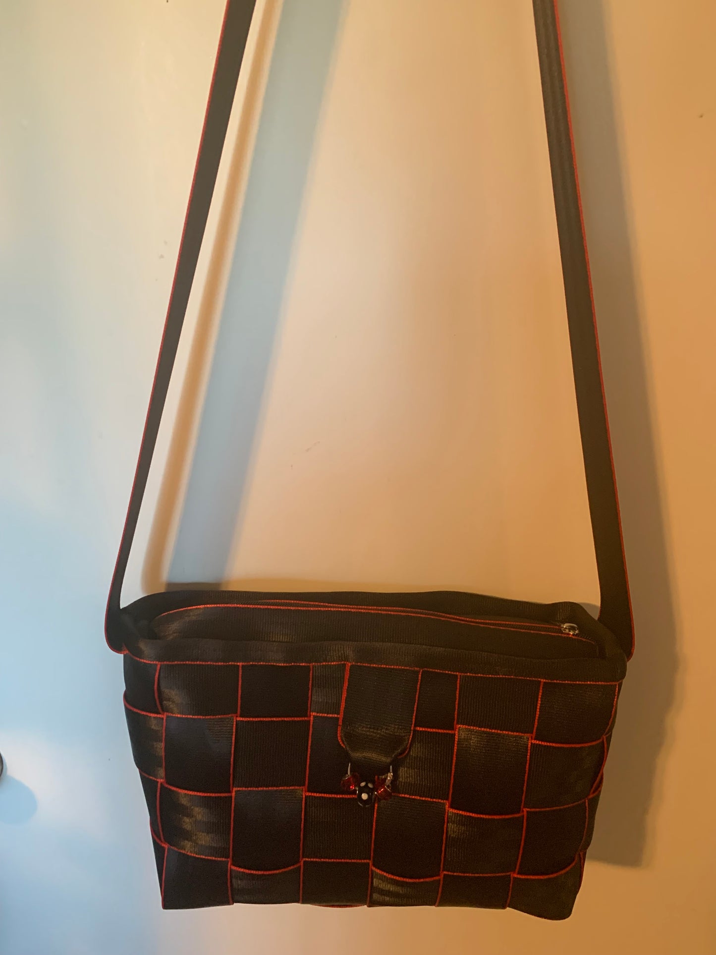 Cross Body Seat Belt Purse in black with red edges, zipper and flap, washable, various linins available