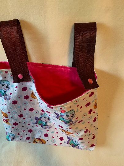 Children's walker bag with seat belt straps and snaps in various patterns